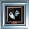 59- blue hand & foot cast in blue frame with black backing