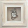 36- single silver hand in white wash wood frame, white backing & mount